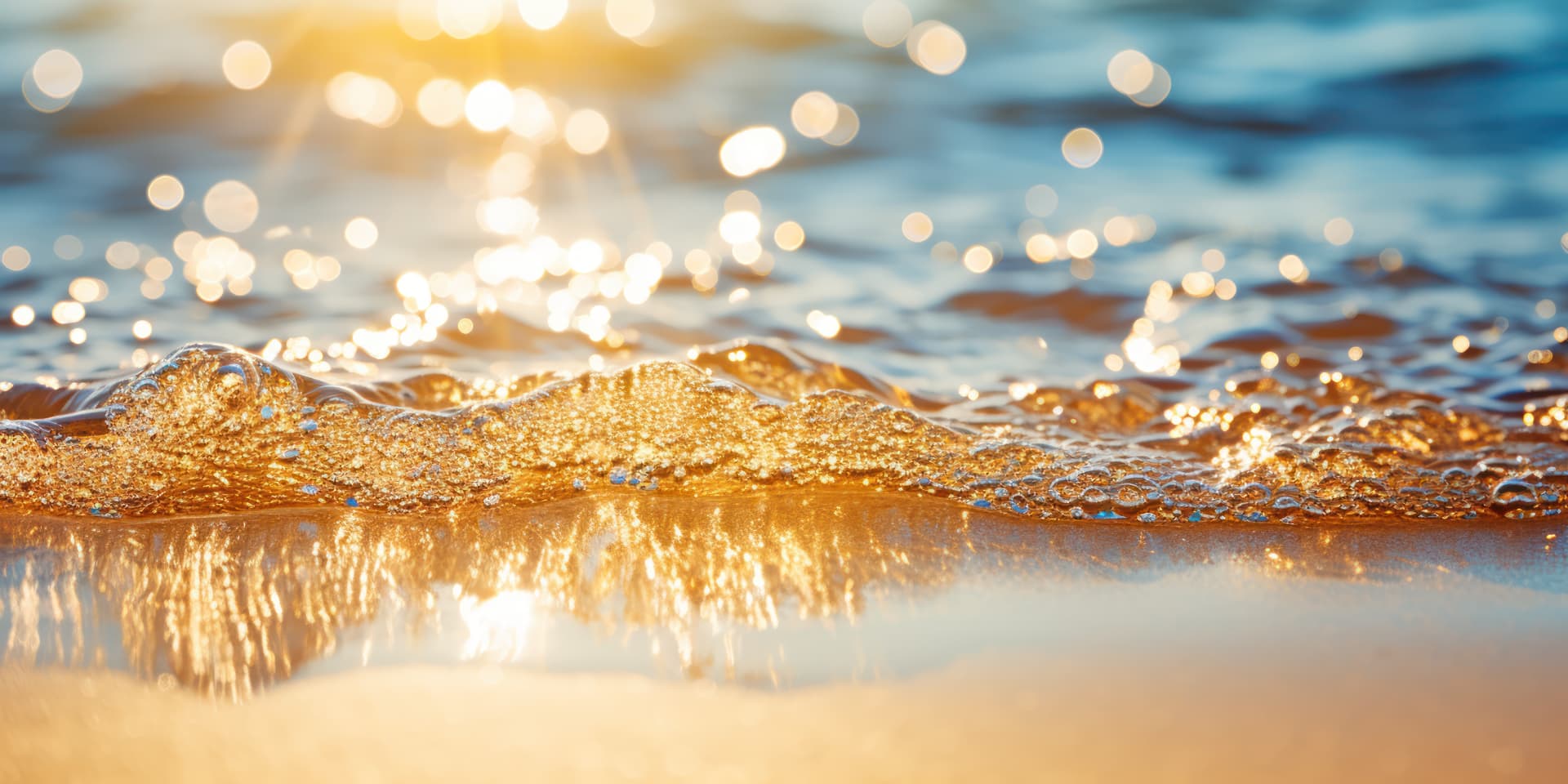 Golden sunset light on gentle ocean surf