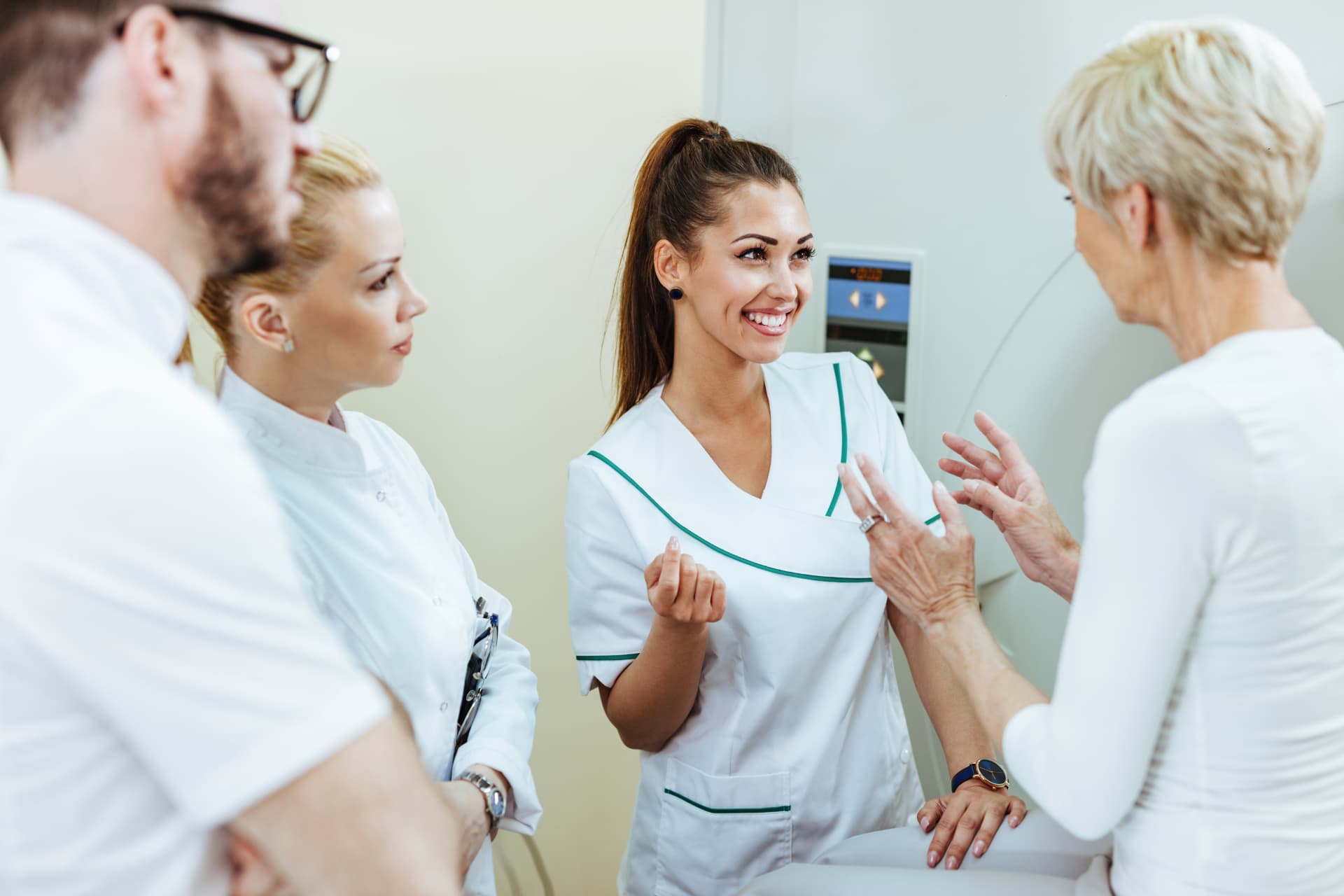 Healthcare team consulting with a guest before a diagnostic procedure